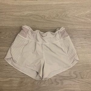 White lululemon shorts, size 8, small stains